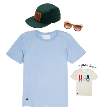 Bickford USA Independence Bundle promotional flat lay — featuring a light blue Everyday Tee, a green wool five-panel cap with a leather flag patch, and wood-frame Timberline sunglasses with gradient brown lenses, alongside an inset image of the limited-edition cream USA Everyday Tee labeled "+ free tee!" in script type, against a white background.